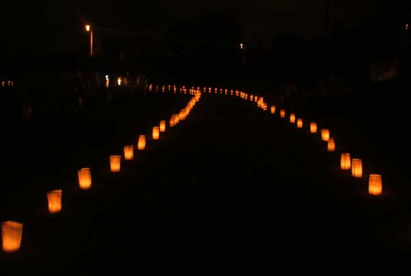 Relay for Life: luminaria commemorating survivors and victims line the track